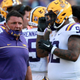 Here we see LSU head coach, Ed Orgeron, yelling directly into the face of an open-mouthed player during the midst of a global pandemic.